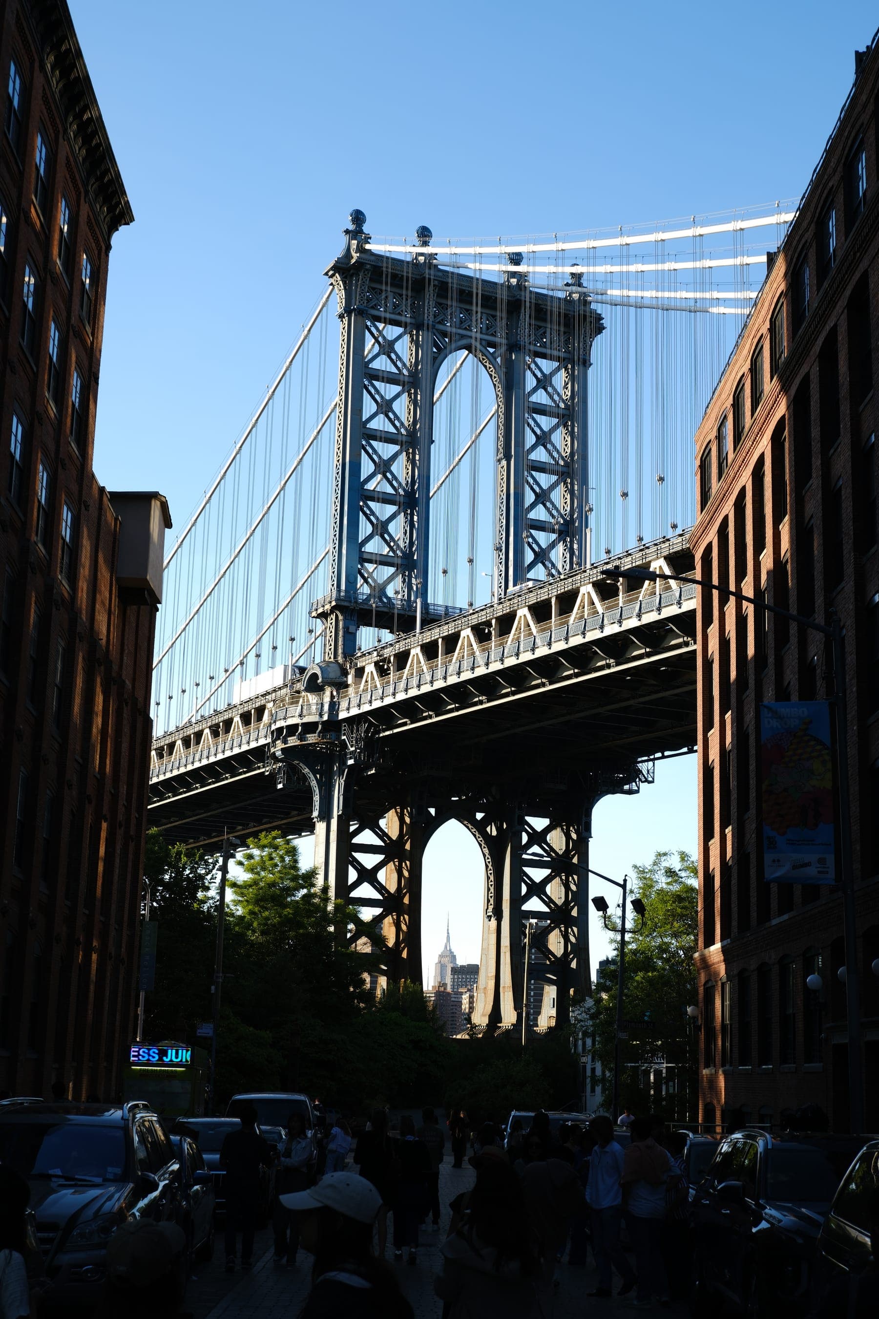 Manhattan Bridge spanning the water beneath the city skyline